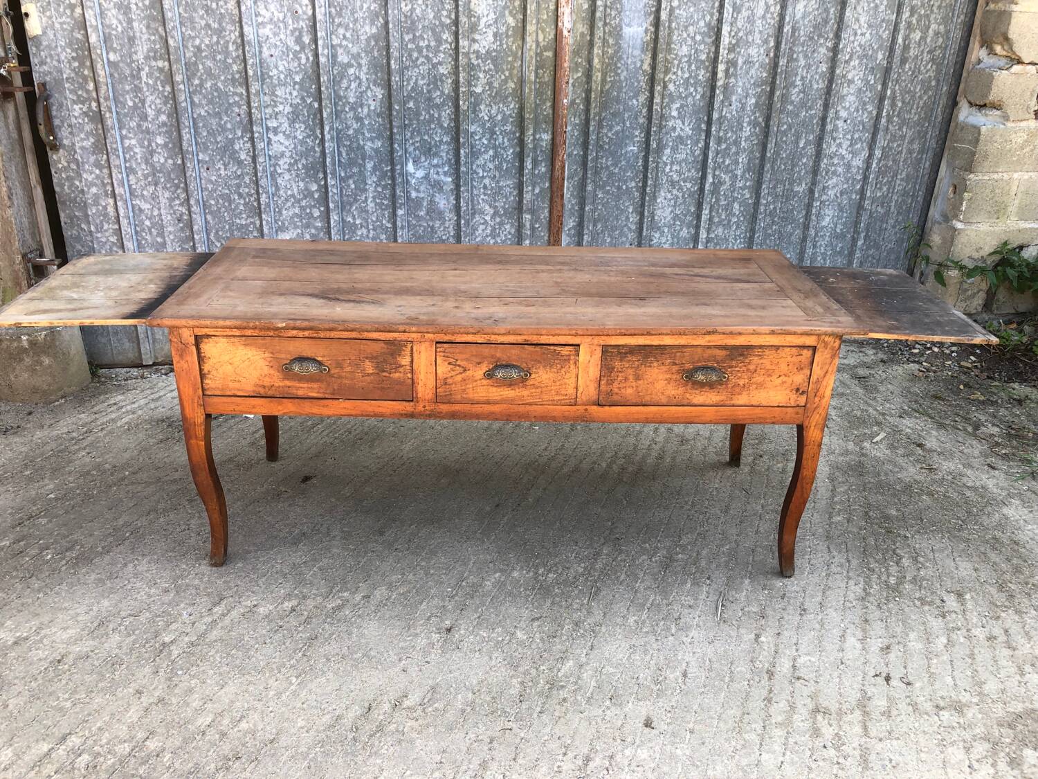 Antique solid cherry farmhouse table with 3 drawers and 2 pulls