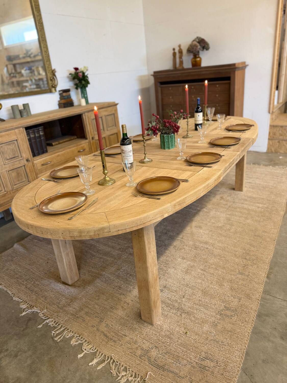 Oval farmhouse table in solid oak with extensions.