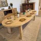 Oval farmhouse table in solid oak with extensions.