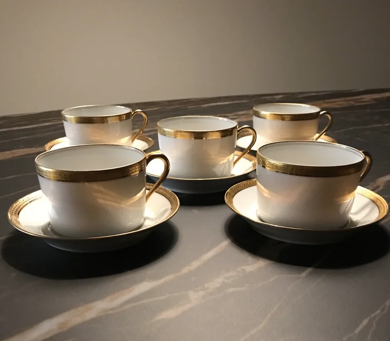 5 Haviland tea cups and sub-cups