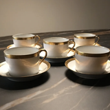 5 Haviland tea cups and sub-cups