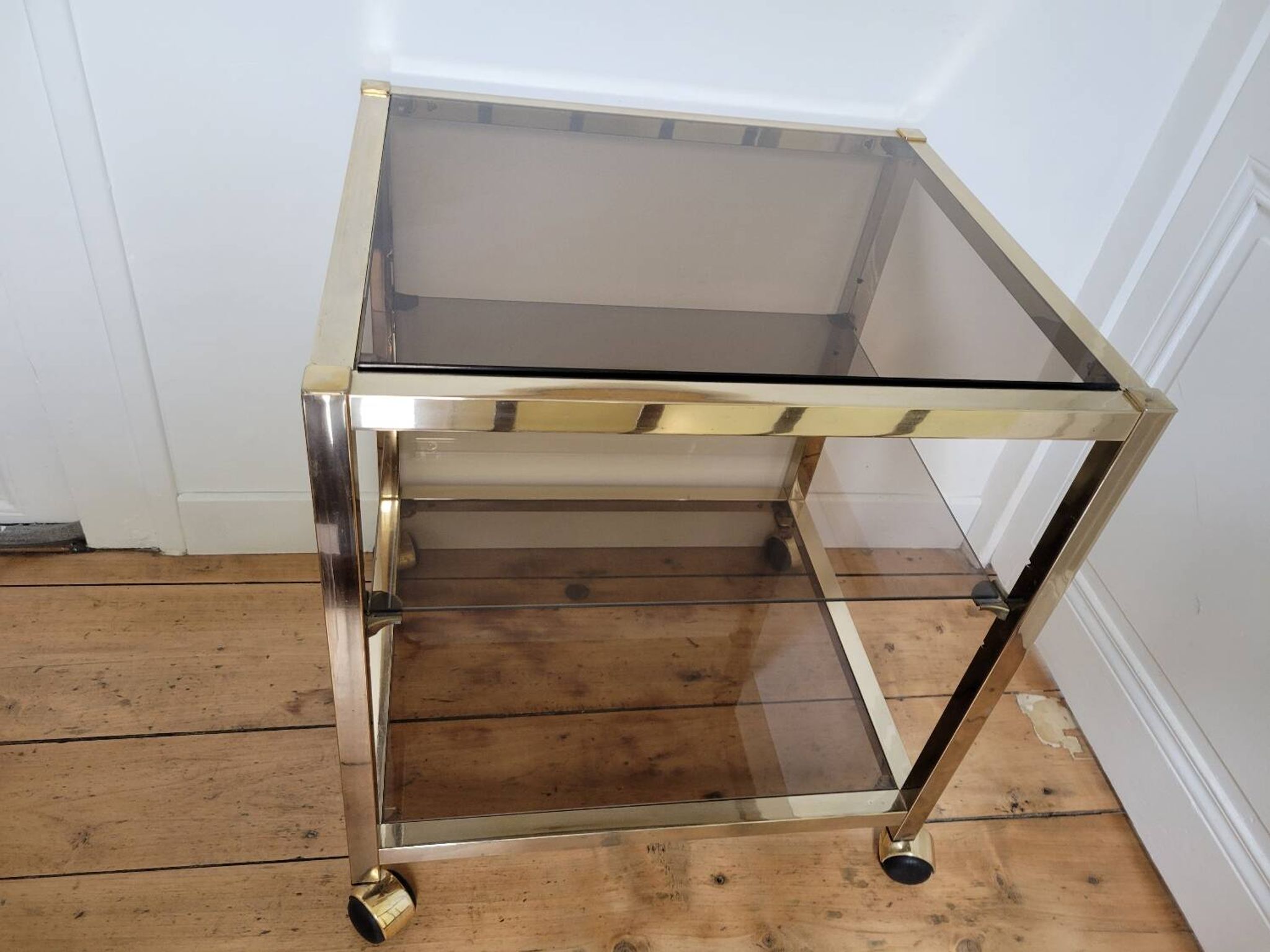 Gold metal and smoked glass serving trolley