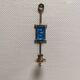 Wall-mounted candle holder in cast iron and hard pressed blue glass.