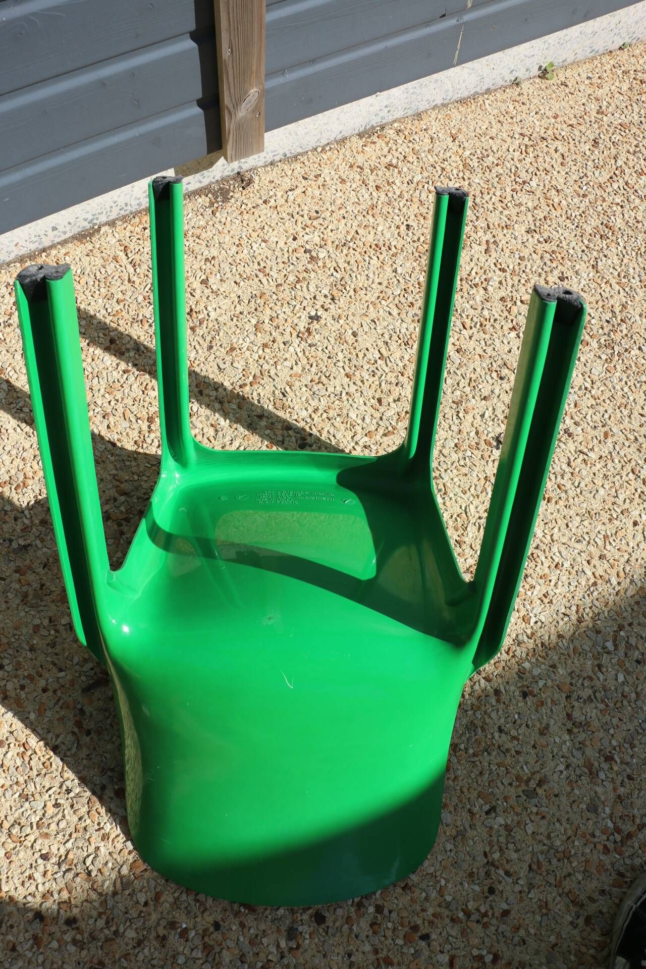 Set of 4 green Selene Magistretti chairs.
