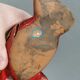 Beautiful seal in ceramic with metallic red glaze.