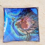 Empty pocket in psychedelic enamelled leather