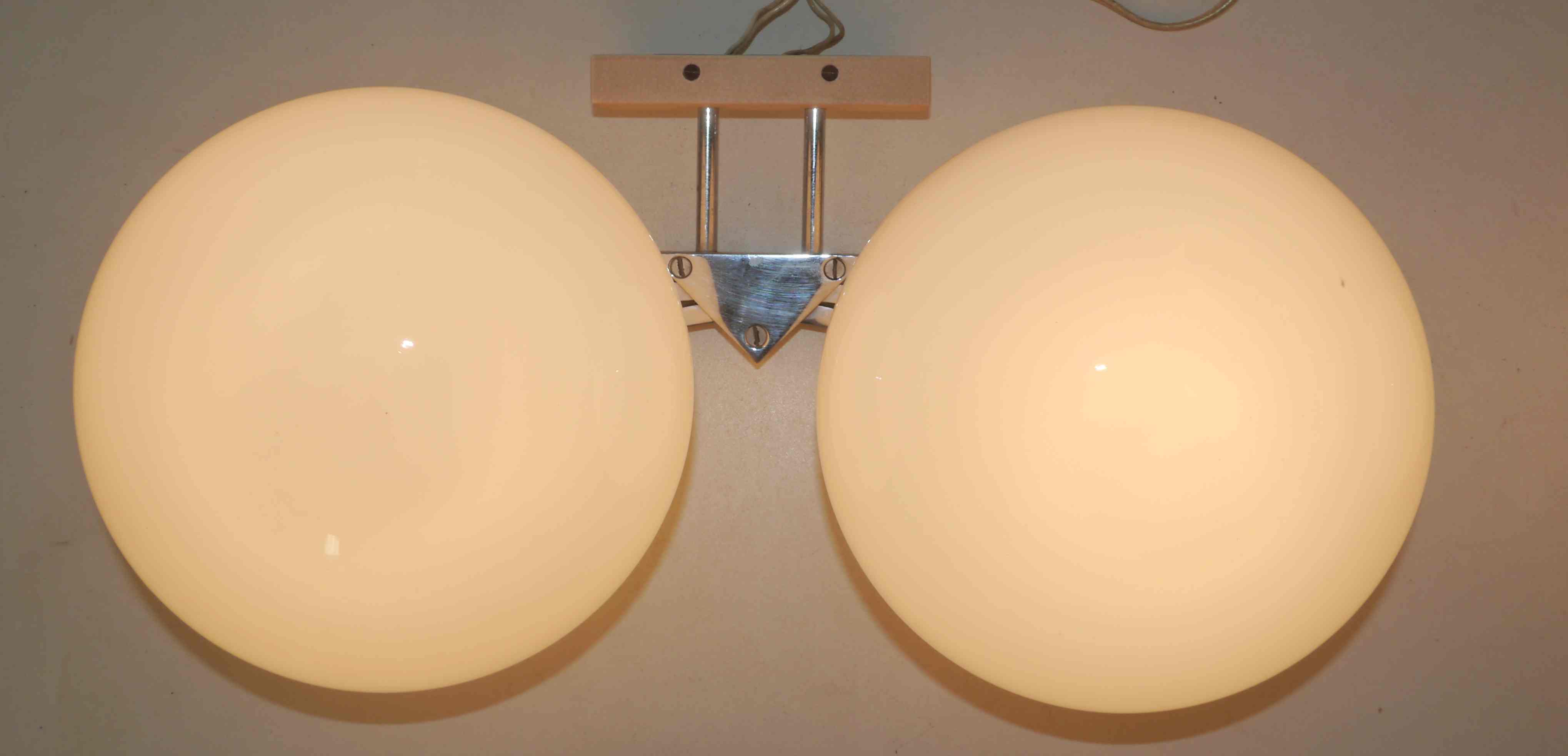 Pair of 60s wall lights in metal and opaline