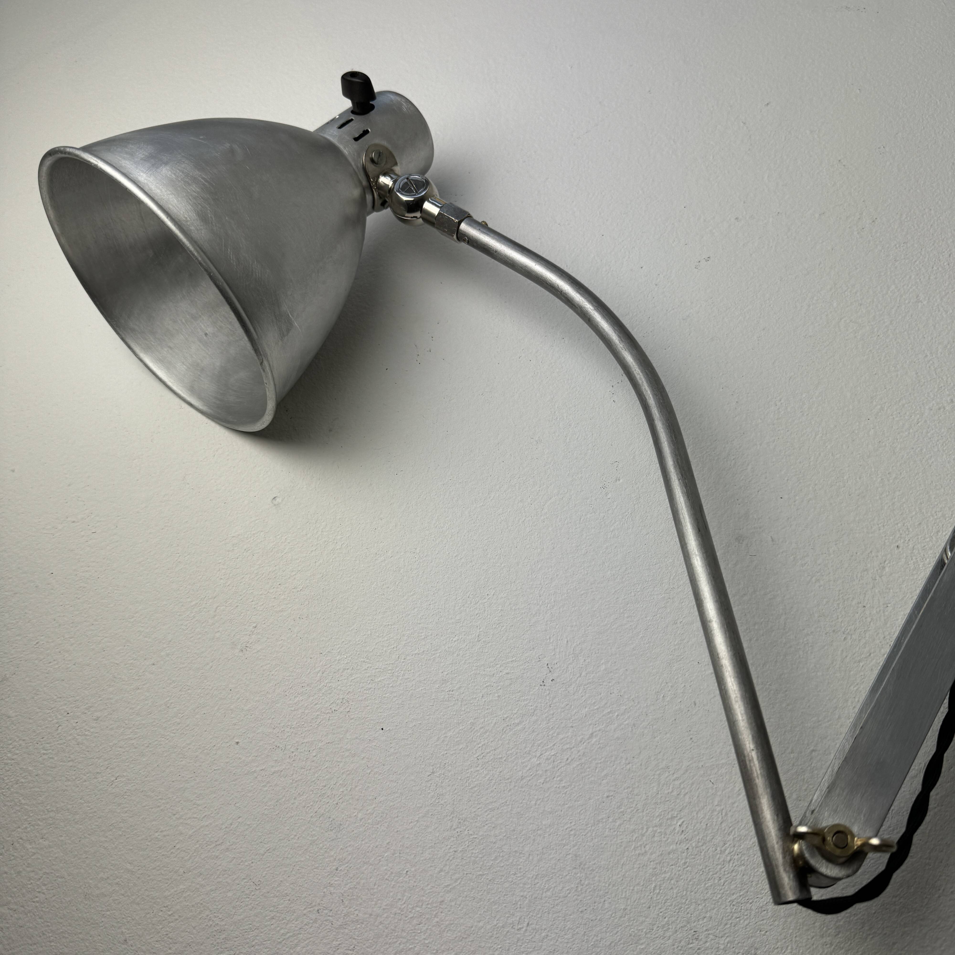 Old large industrial accordion wall lamp
