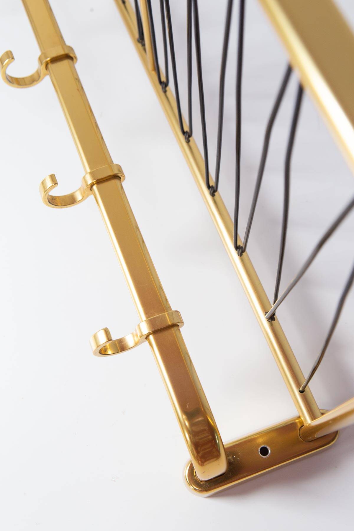 Wall-mounted coat rack with a golden aluminium shelf c. 1960 (62.5 cm)