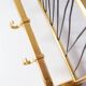 Wall-mounted coat rack with a golden aluminium shelf c. 1960 (62.5 cm)