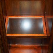 Theodore Alexander library in faux books in burl laurel.