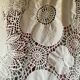 White cotton tablecloth with crochet lace.