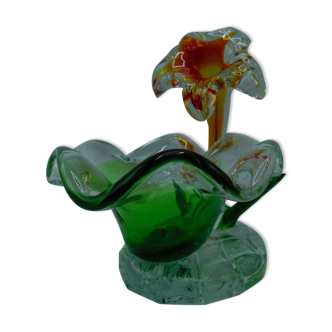 Cup has blown glass jewelry