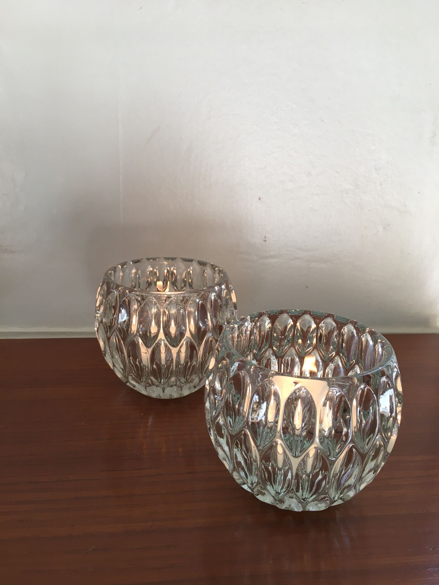 Duo of chiseled glass photophores