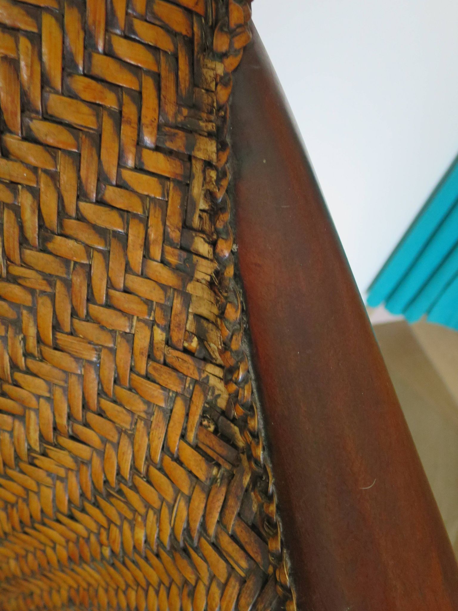 Woven rattan armchair and exotic wood in colonial style, 1980s.