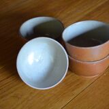 Lot of 4 bowls in sandstone and shiny grey inside