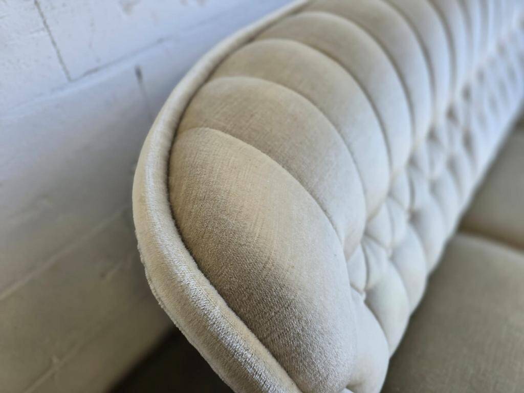 Vintage beige sofa with fringes