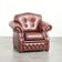 Cowhide chesterfield armchair in a warm brown colour with decorative nails