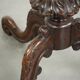 Round antique side table / wine table with rich carvings