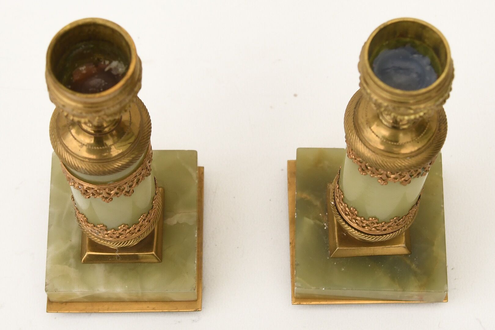 Pair of small candlesticks in golden brass and onyx