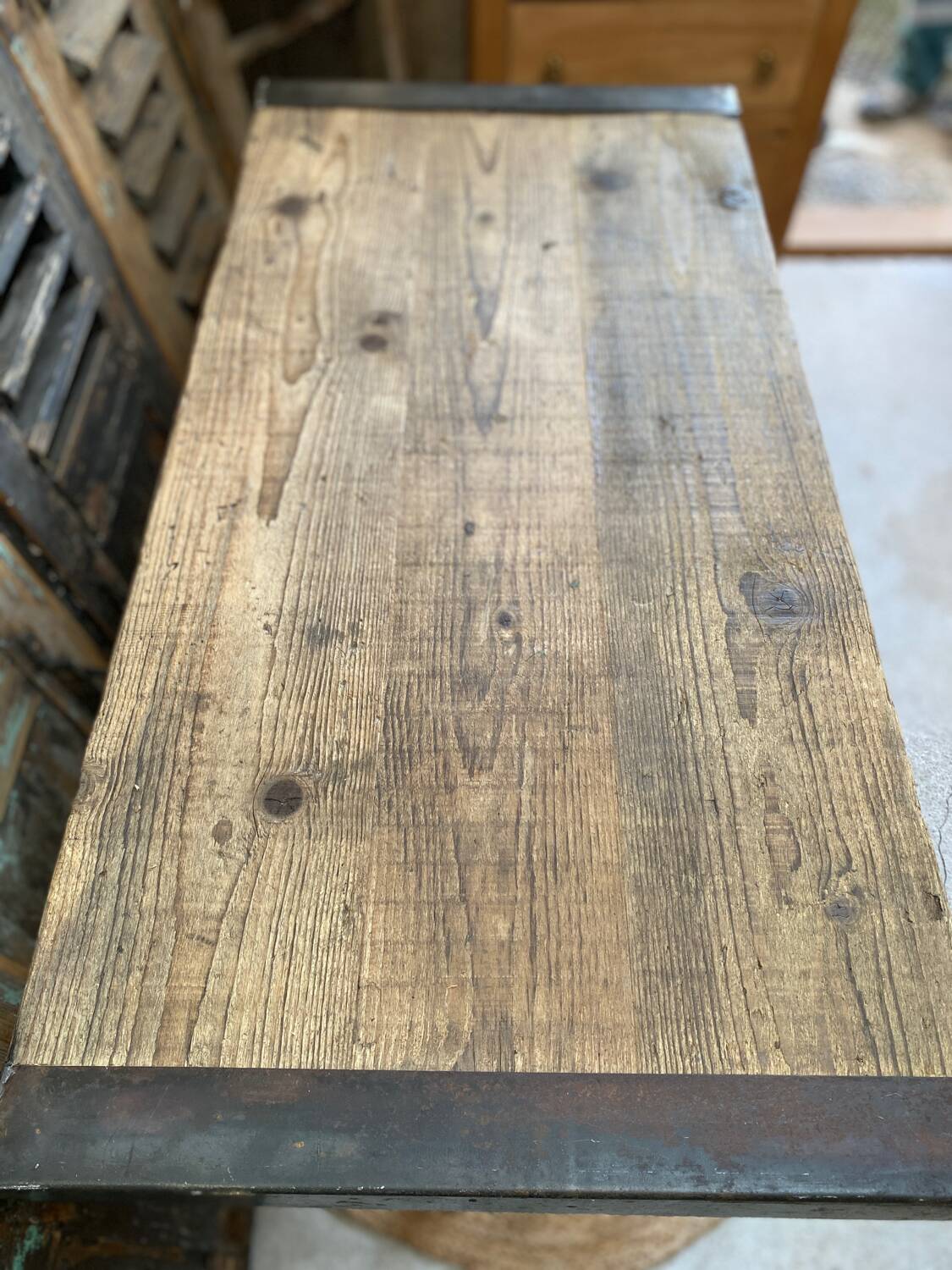 Vintage wooden table with a cast iron base.