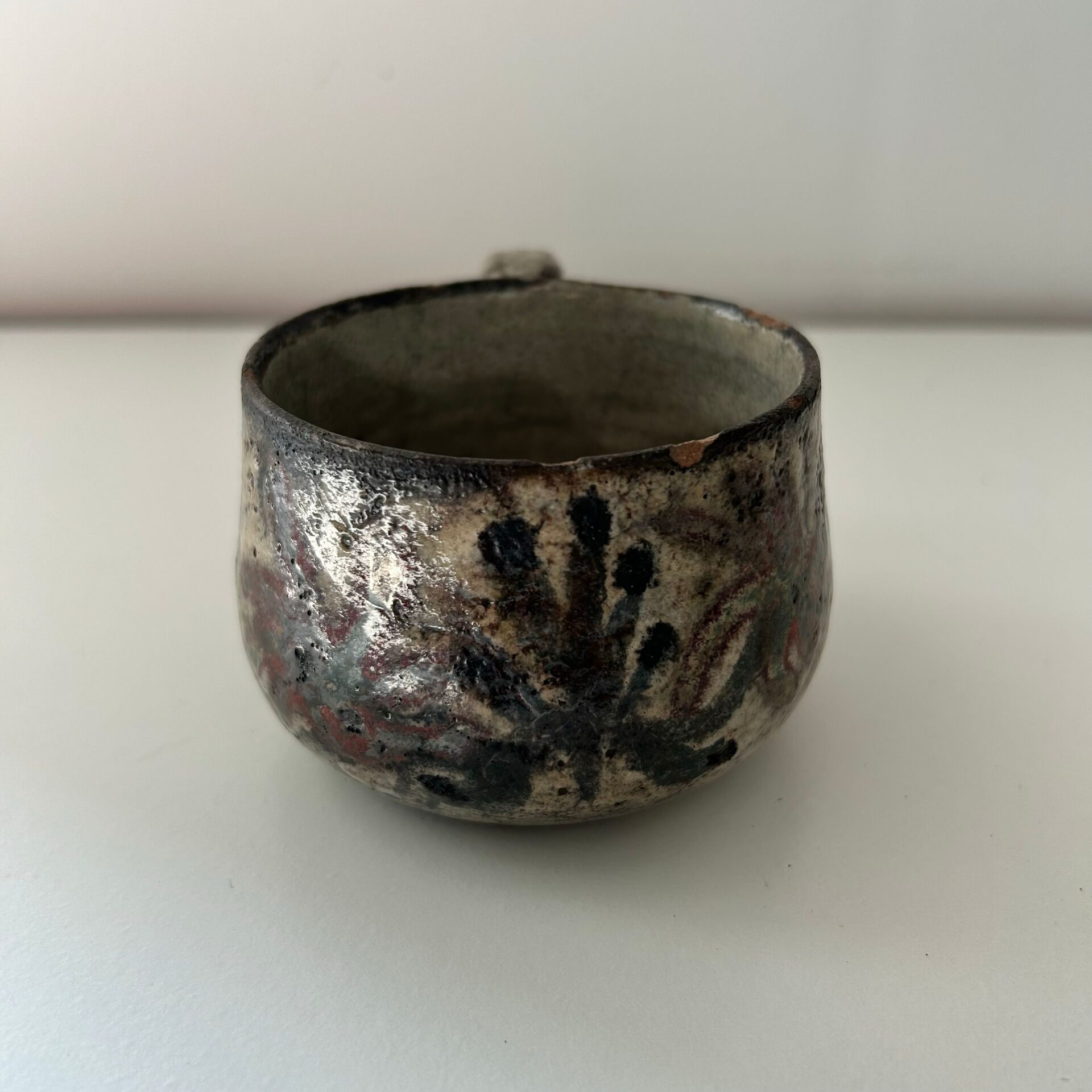 Handcrafted mug with floral decoration