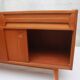 1950s cherry wood sideboard with sliding doors.
