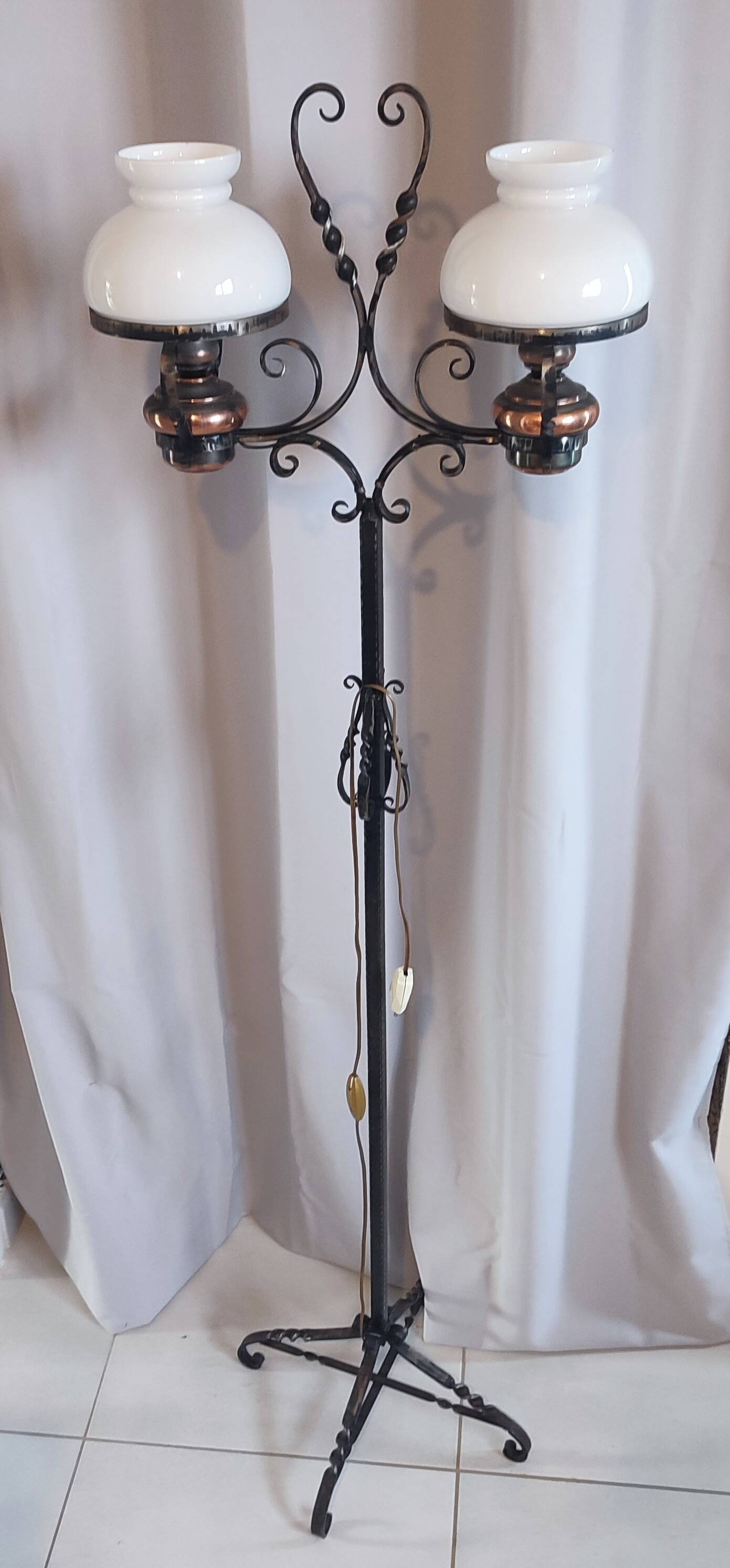 Antique double globe opaline floor lamp, wrought iron, rustic vintage style.