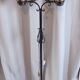 Antique double globe opaline floor lamp, wrought iron, rustic vintage style.