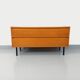 Small vintage Scandinavian sideboard in modernist style made of light oak wood.