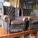 Padded chesterfield leather armchairs
