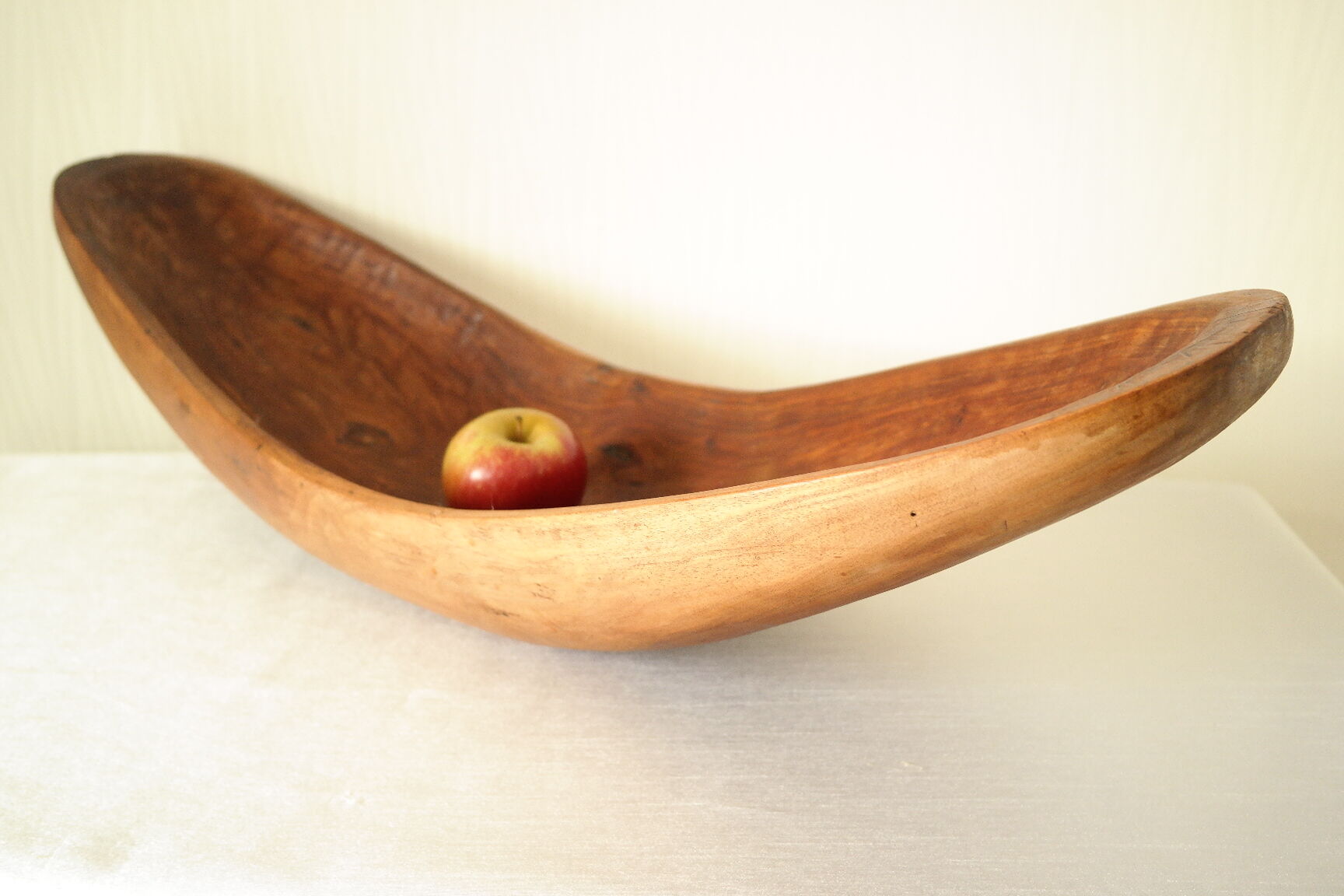 Brutalistic cut in exotic wood boomerang shape