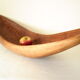 Brutalistic cut in exotic wood boomerang shape