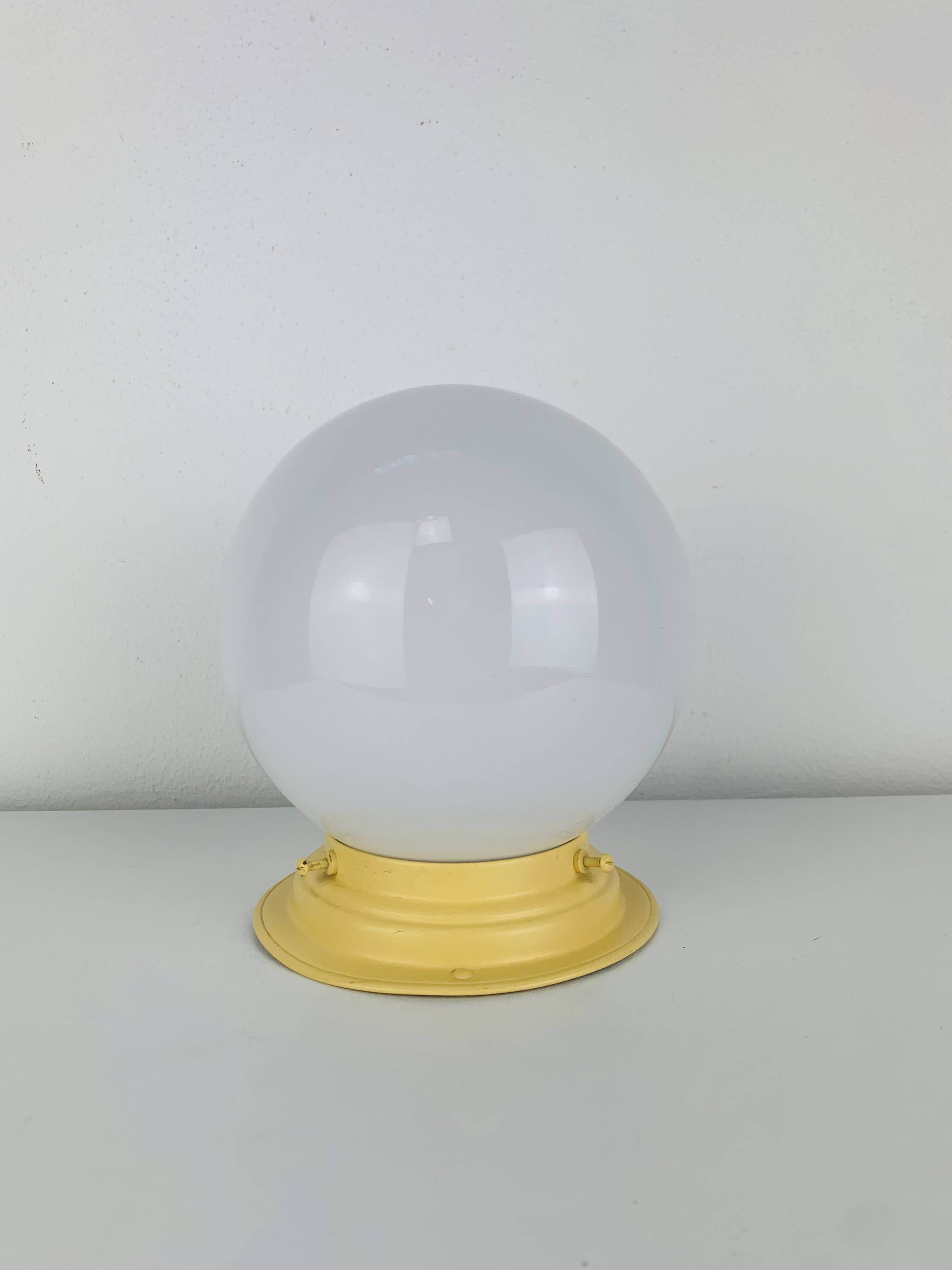 Art Deco opaline globe wall or ceiling light, yellow base