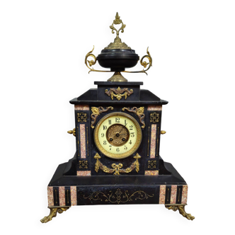 Large notary clock in black marble and gilded bronze.