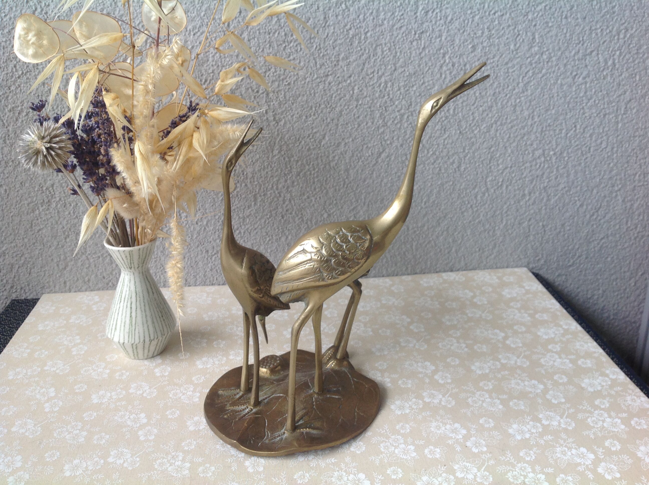 Golden brass herons