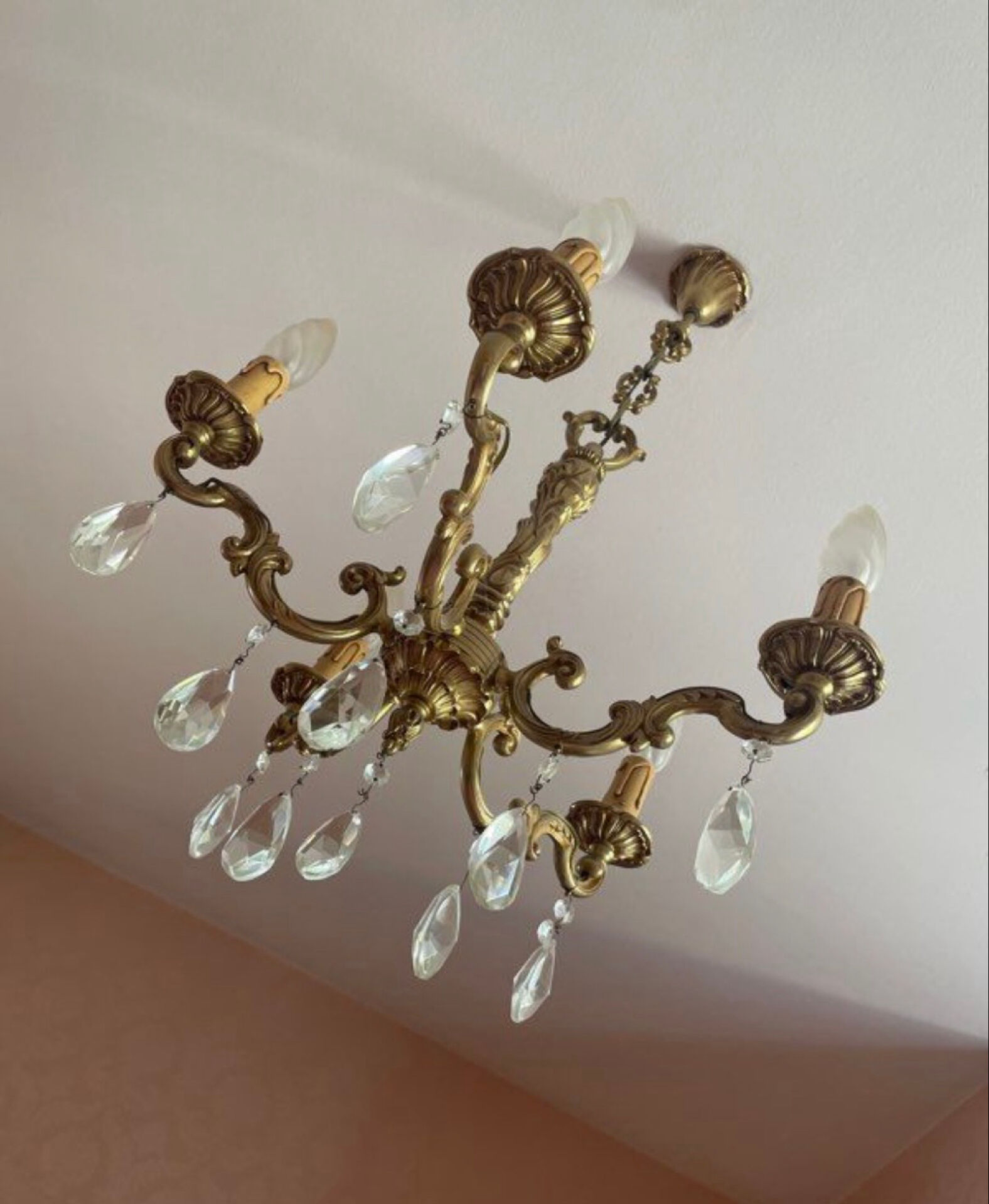 Magnificent bronze chandelier with pendants.