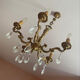 Magnificent bronze chandelier with pendants.