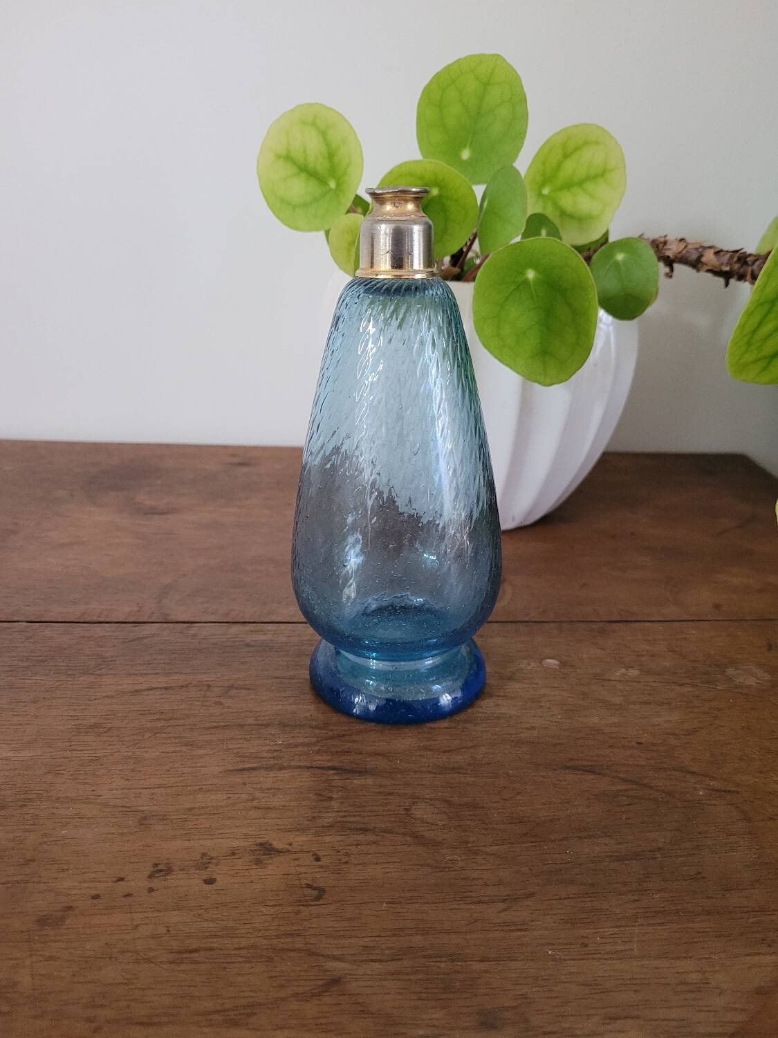 Small blue twisted glass bottle