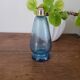 Small blue twisted glass bottle