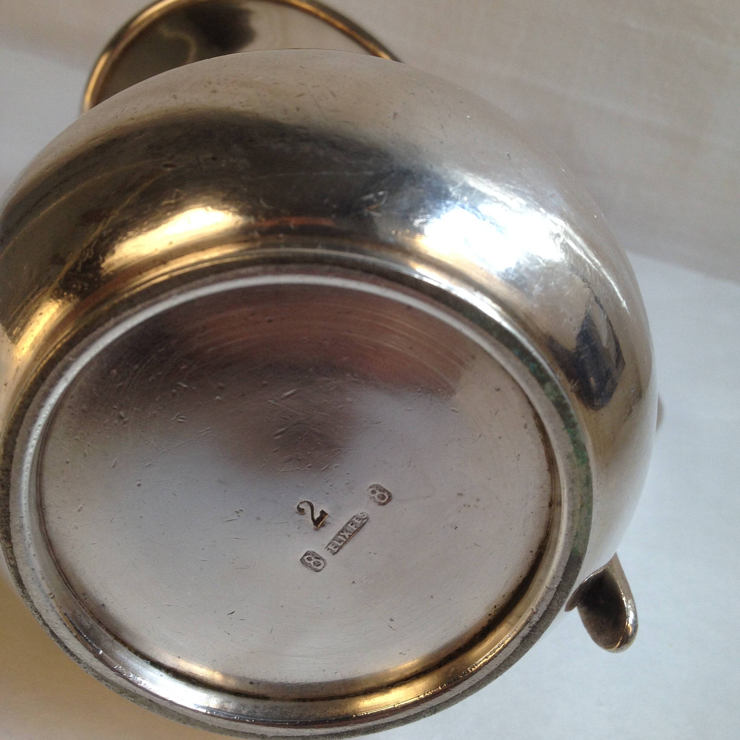 Silver metal milk jug