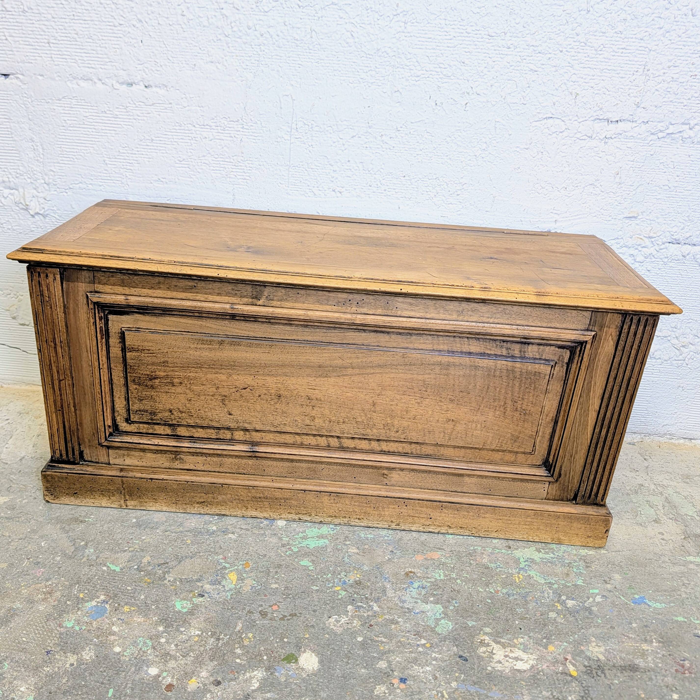 Antique wooden chest with moulded panels