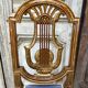 Paire de chaises style Louis XVI en bois doré
