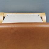 Folding Stool, in light beech wood with cognac colored leather cushion.