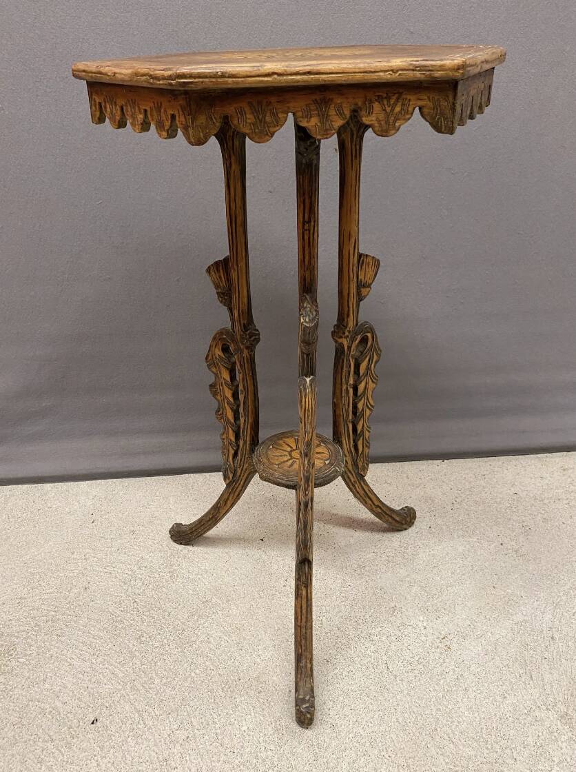 Carved wooden pedestal table