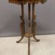Carved wooden pedestal table