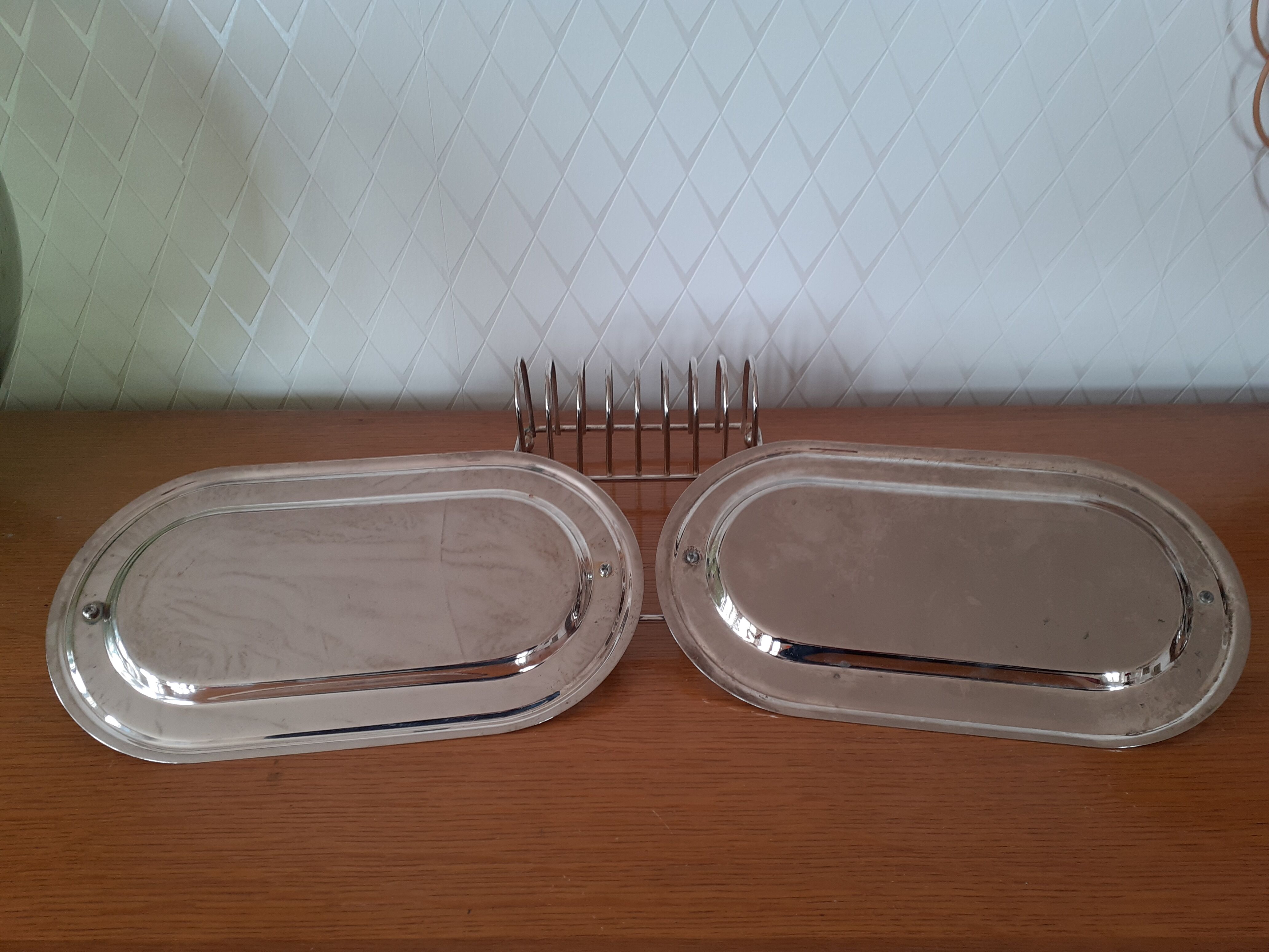 Two foie gras dishes and their toast holder