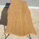 Violin-shaped coffee table with brass legs