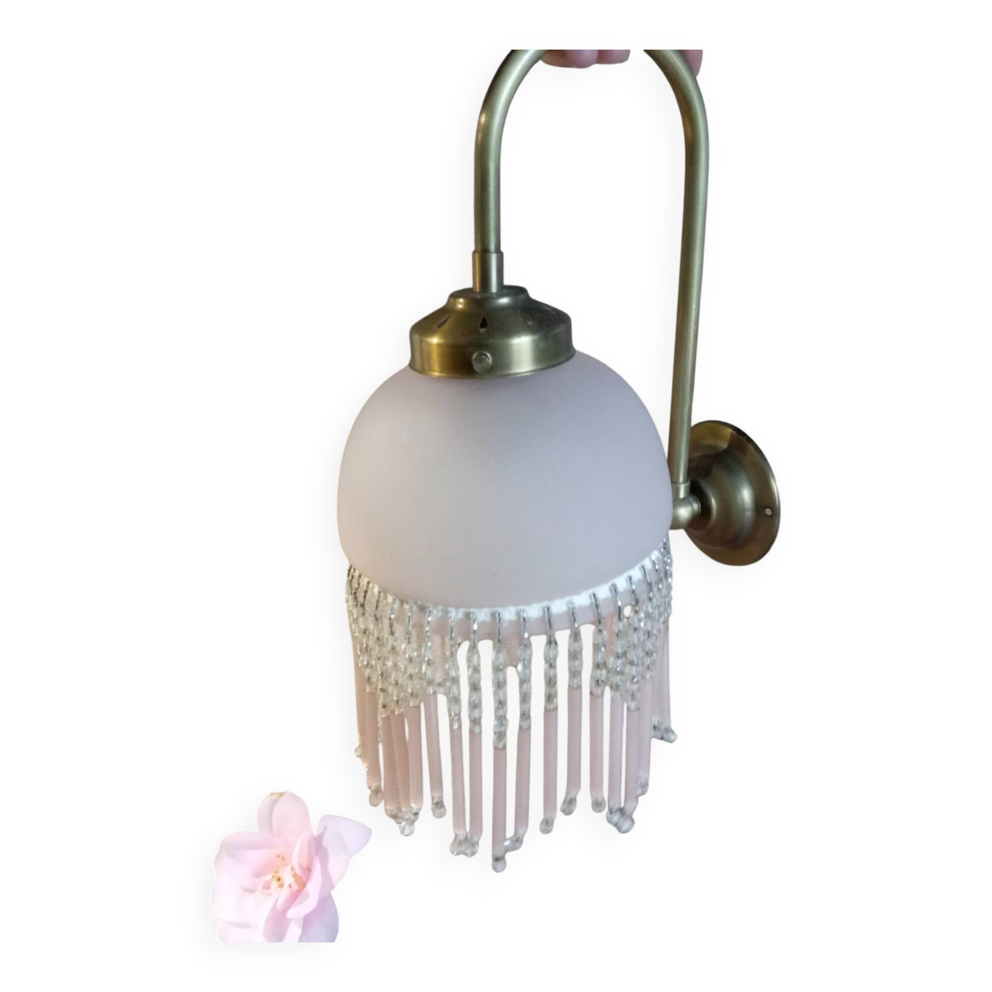 Brass swan neck wall lamp with pink glass globe and Charleston tassels