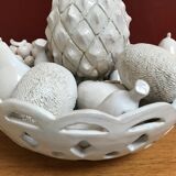 Trompe l'oeil fruit cut in white earthenware by Jean Roger, circa 1960.